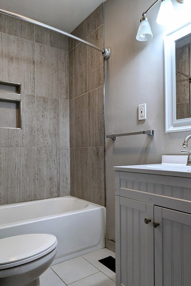 full bathroom with bathtub / shower combination, tile patterned floors, vanity, and toilet