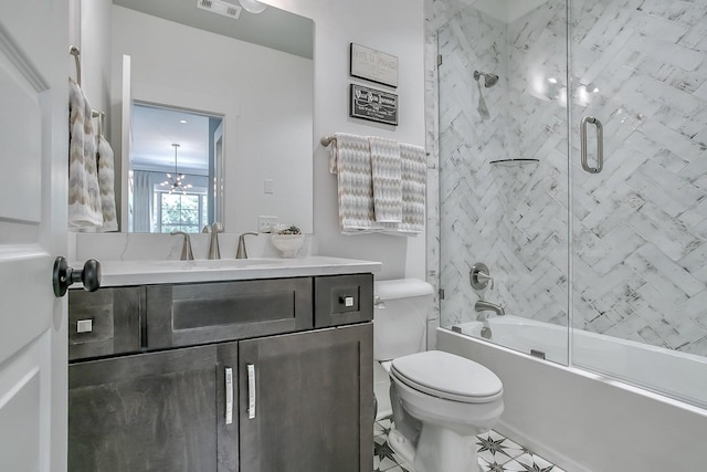 full bathroom with shower / bath combination with glass door, toilet, and vanity