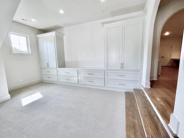 unfurnished bedroom with light colored carpet