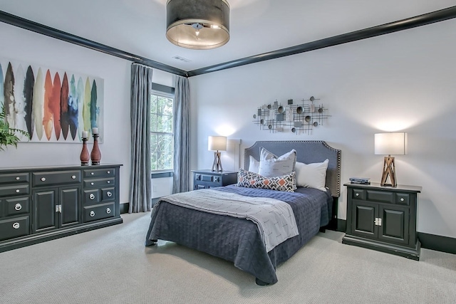 carpeted bedroom featuring ornamental molding