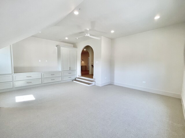 bonus room with ceiling fan, light colored carpet, and lofted ceiling