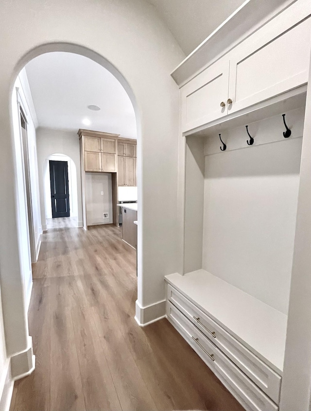 mudroom with light hardwood / wood-style flooring