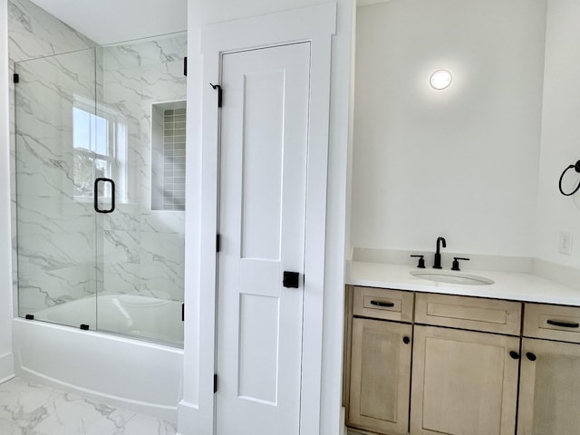 bathroom with vanity and shower / bath combination with glass door