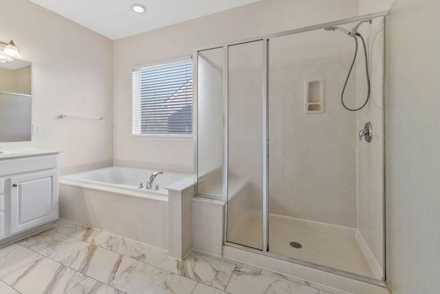 bathroom with plus walk in shower and vanity