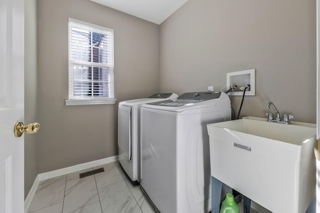 laundry area featuring sink and independent washer and dryer