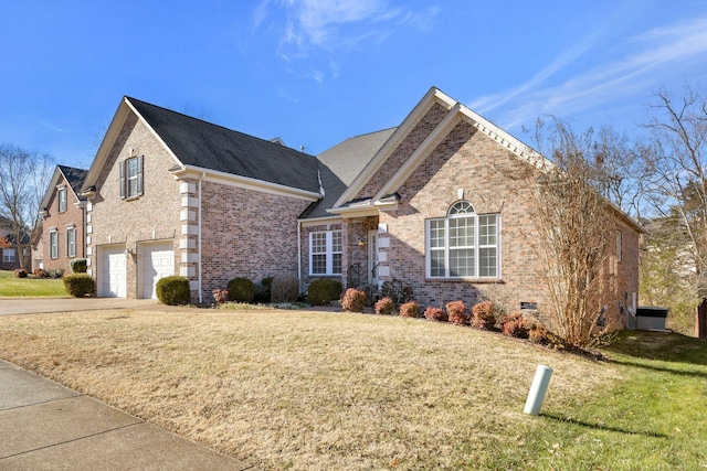 view of property with a garage and a front yard