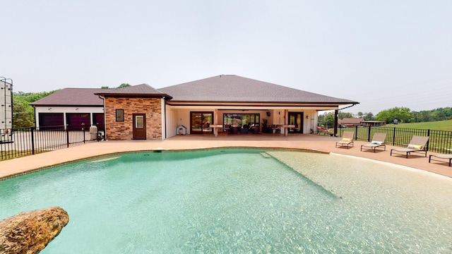 view of swimming pool with a patio area