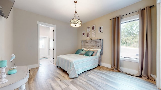 bedroom with light wood-type flooring