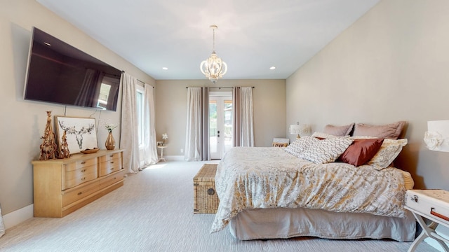 bedroom with a chandelier and carpet flooring