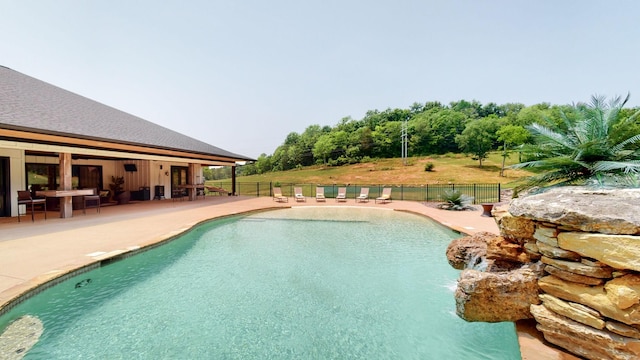 view of swimming pool featuring a patio