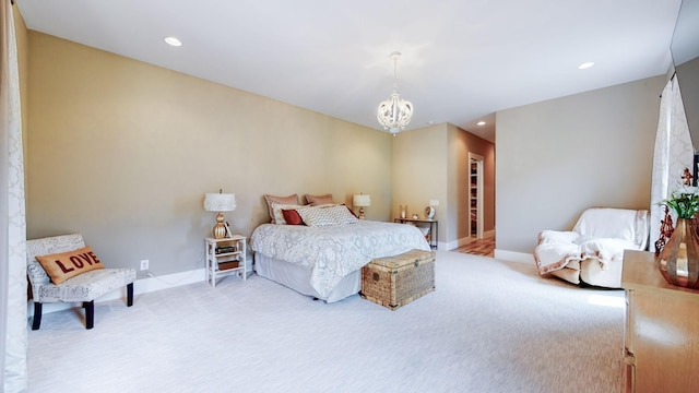 carpeted bedroom with a chandelier