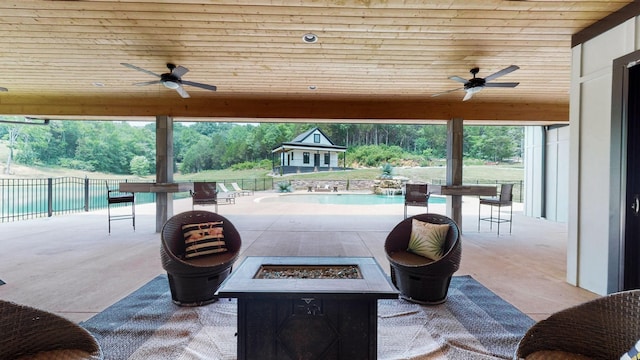 view of patio featuring a fire pit and ceiling fan