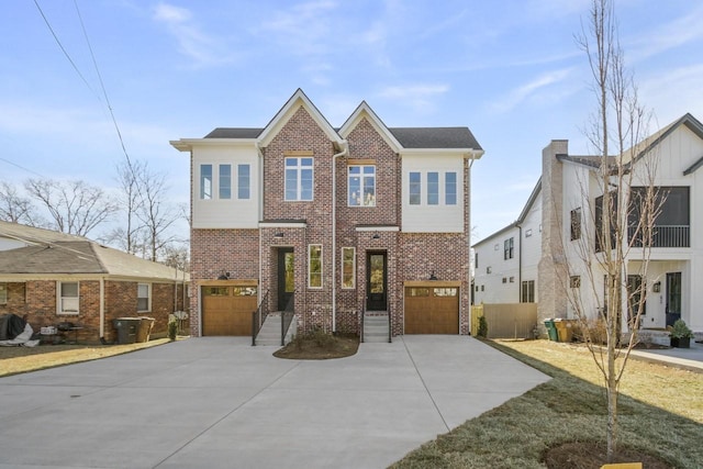 view of front facade with an attached garage, driveway, and brick siding