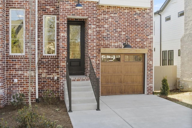 doorway to property with a garage