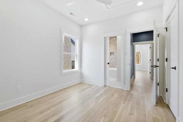 spare room featuring light hardwood / wood-style floors