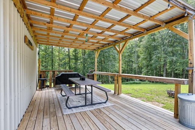 deck with grilling area and a lawn