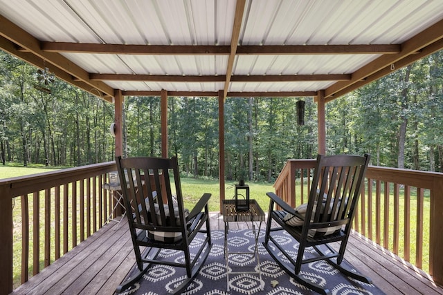 wooden deck featuring a yard