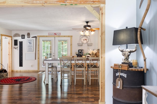 dining space featuring dark wood-type flooring, ceiling fan, and french doors