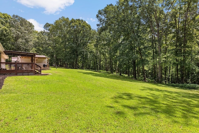 view of yard with a deck