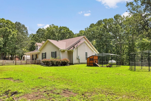 view of side of home featuring a lawn