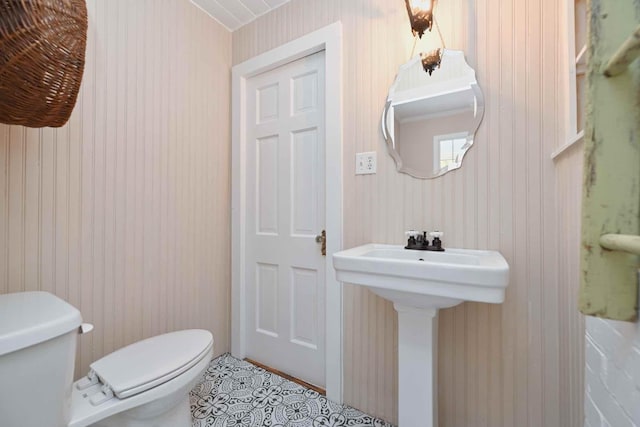 bathroom featuring sink and toilet