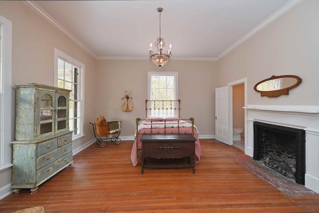 dining space with light hardwood / wood-style flooring, a wealth of natural light, and crown molding