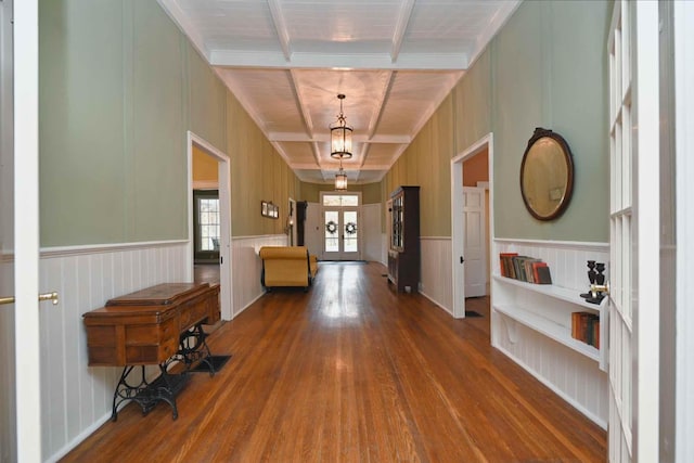 corridor with hardwood / wood-style flooring, beamed ceiling, and french doors