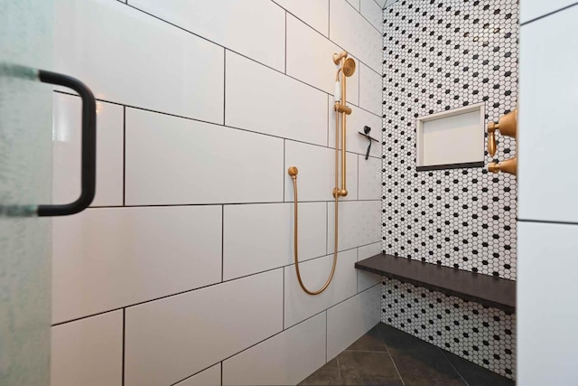 interior details featuring a shower and white fridge