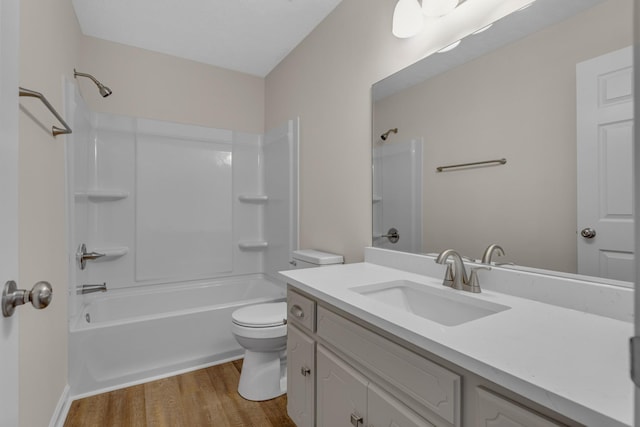 full bathroom with bathing tub / shower combination, hardwood / wood-style flooring, toilet, and vanity