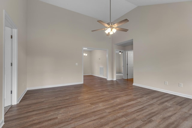 empty room with ceiling fan, dark wood-type flooring, and high vaulted ceiling