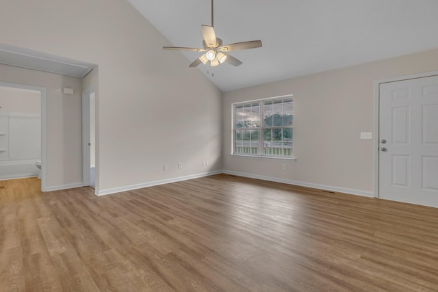 interior space featuring ceiling fan, high vaulted ceiling, and light wood-type flooring