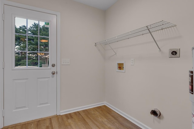 laundry area with hardwood / wood-style flooring, hookup for a washing machine, and hookup for an electric dryer