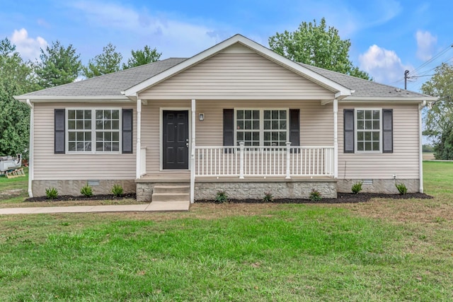 ranch-style house with covered porch and a front lawn