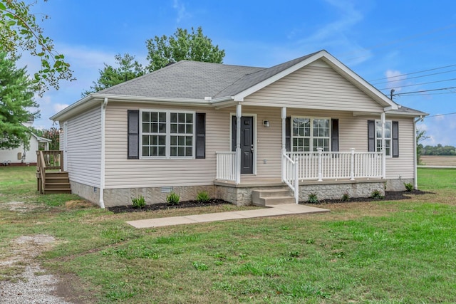 view of front of property featuring covered porch and a front yard