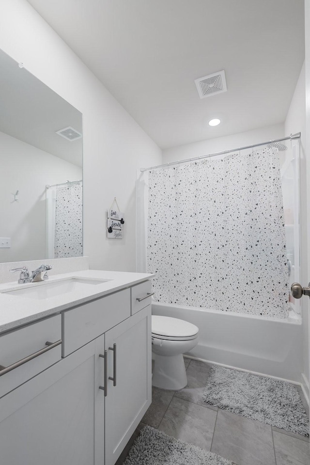 full bathroom with vanity, tile patterned floors, toilet, and shower / tub combo with curtain