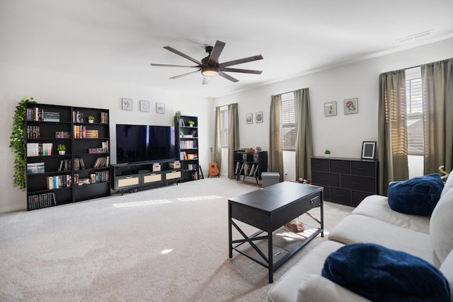 living room with light carpet and ceiling fan