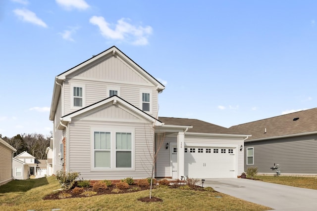 view of front of house with a garage and a front yard