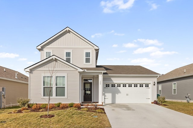 view of front of property featuring a garage and a front lawn