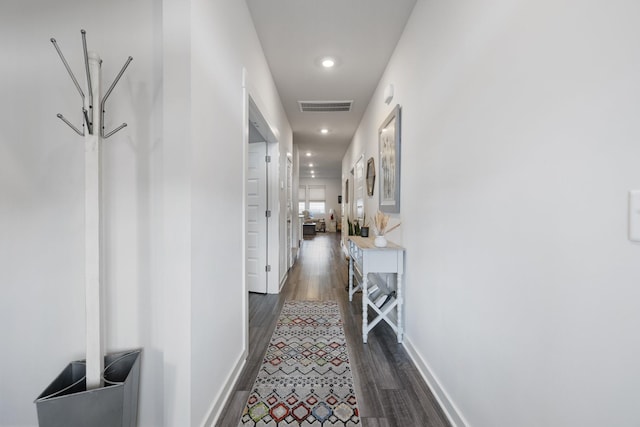 corridor featuring dark wood-type flooring