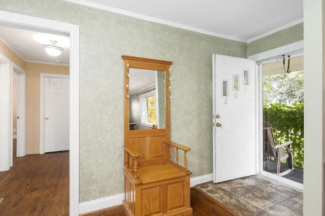 entrance foyer with dark wood-type flooring and ornamental molding