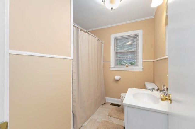 bathroom with vanity, toilet, ornamental molding, and a shower with curtain