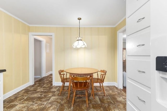 dining space with crown molding