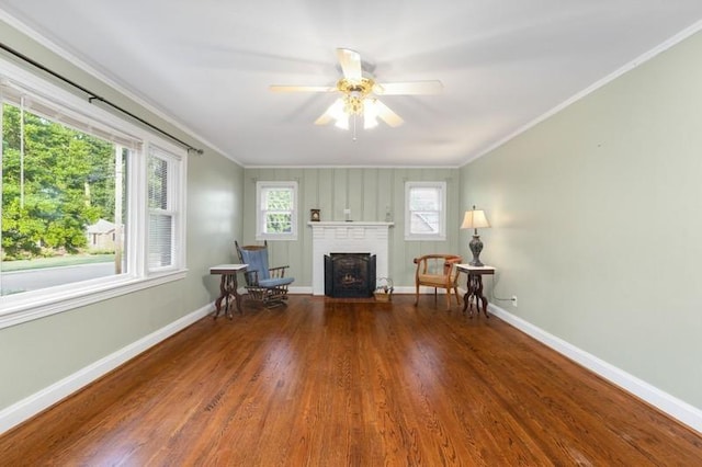 unfurnished room featuring hardwood / wood-style flooring, ceiling fan, and ornamental molding