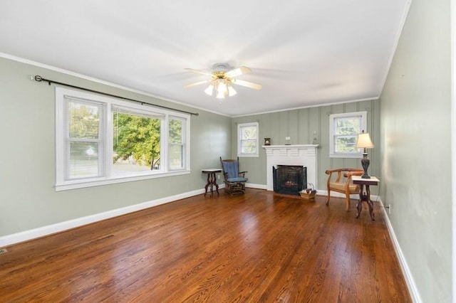 unfurnished room featuring hardwood / wood-style flooring, ceiling fan, and crown molding