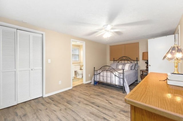 bedroom featuring a closet, ceiling fan, connected bathroom, and hardwood / wood-style flooring