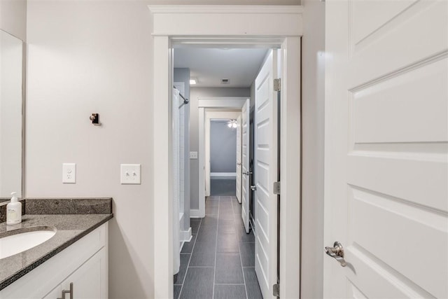 bathroom featuring vanity and tile patterned flooring