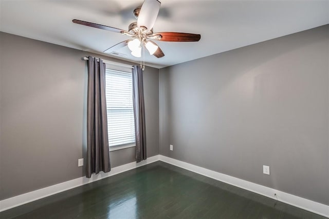 unfurnished room featuring ceiling fan and dark hardwood / wood-style floors