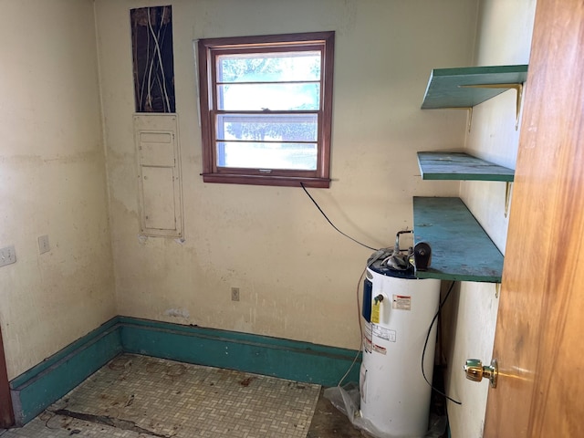 utility room featuring electric water heater