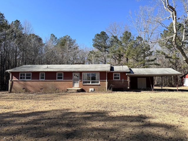 single story home featuring a carport