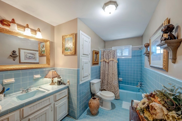 full bathroom featuring toilet, tile walls, tile patterned flooring, shower / bath combination with curtain, and vanity